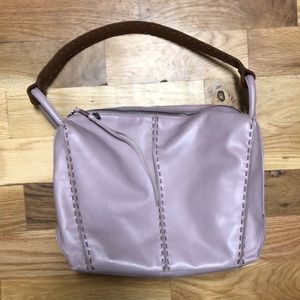 The sak light pink shoulder bag, purse.